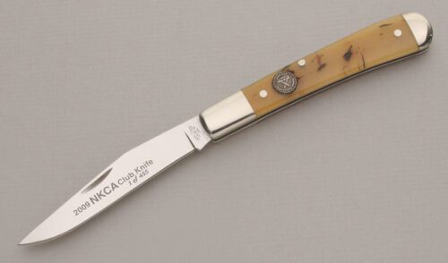 Canal Street Cutlery 2009 NKCA Half Moon Trapper with Smooth Oiled Rams Horn Scales handle material - Obverse Side - Item #KLC13538