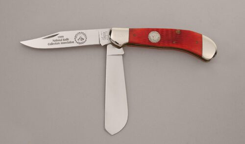 Case Cutlery 1999 NKCA Saddlehorn Trapper with Red Jigged Bone Scales handle material - Obverse Side - Item #KLC13698