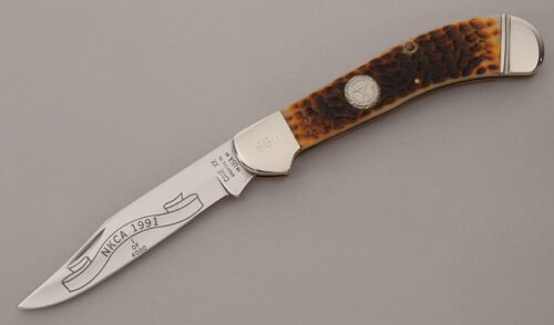 Case Cutlery 1991 NKCA Saddlehorn Folder with Jigged Bone Scales handle material - Obverse Side - Item #KLC13700