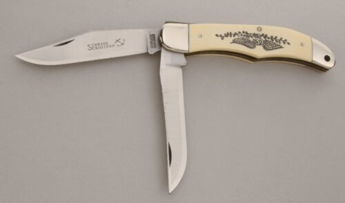 Schrade Cutlery Scrimshaw Folding Hunter with Ivory Delrin Handle Scales handle material - Obverse Side - Item #KLC13738
