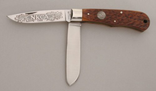 Camillus Cutlery 1988 NKCA Trapper with Brown Jigged Bone Scales handle material - Obverse Side - Item #KLC13833