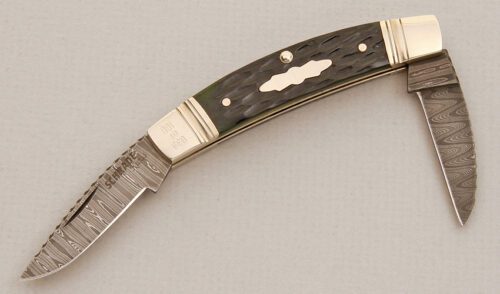 Schrade Cutlery Joe Kious Reverse Congress with Hunter Green Jigged Bone handle material - Obverse Side - Item #KLC13866