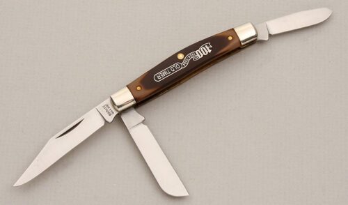 Schrade Cutlery 100th Anniversary Old Timer with Sawcut Delrin Handle Scales handle material - Obverse Side - Item #KLC13985