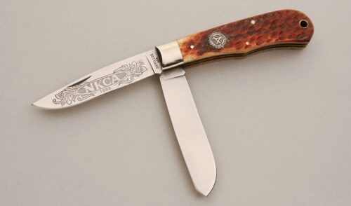 Camillus Cutlery 1988 NKCA Trapper with Brown Jigged Bone Scales handle material - Obverse Side - Item #KLC14003