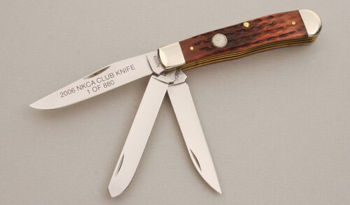 Kinfolks Knives 2006 NKCA Three Blade Trapper with Walnut Jigged Bone Scales handle material - Obverse Side - Item #KLC14015