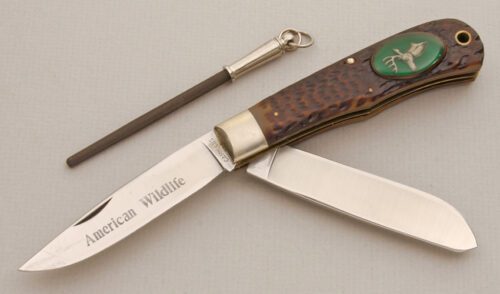 Camillus Cutlery Wildlife Series Trapper Deer with Jigged Delrin Handle Scales handle material - Obverse Side - Item #KLC14115
