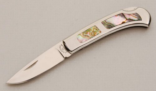 A.G. Russell Interframe Lockback Folder with Stainless Frame handle material - Obverse Side - Item #KLC14194