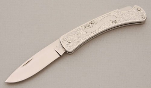 Buck Knives 510 Engraved Lockback with Engraved Aluminum Frame handle material - Obverse Side - Item #KLC14658