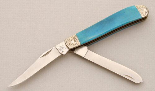 Buck Knives 1990 Model 312 Mini Trapper with Smooth Blue Bone Scales handle material - Obverse Side - Item #KLC14671