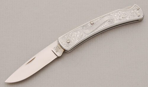 Buck Knives Model 513 Classic III with Engraved Aluminum Frame handle material - Obverse Side - Item #KLC14860