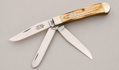 Case Cutlery 1997 IBCA 3 Blade Trapper with Jigged Burnt Bone Scales handle material - Obverse Side - Item #KLC14916