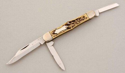 Camillus Cutlery Sword Brand 3 Blade Trapper with Jigged & Dyed Celluloid Scales handle material - Obverse Side - Item #KLC14937
