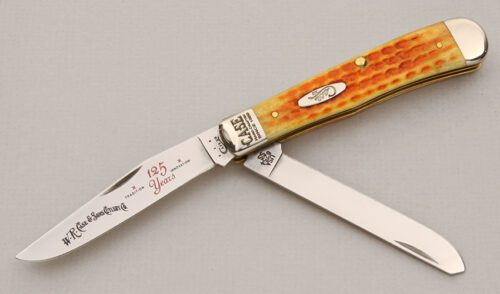 Case Cutlery 6254 125th Anniversary Trapper with Orange Jigged Bone Scales handle material - Obverse Side - Item #KLC15058