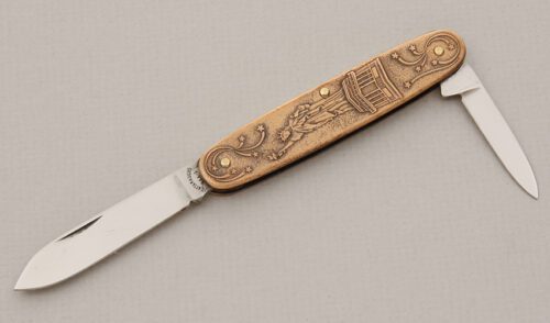 Cattaraugus Cutlery Centennial Liberty Folder with Embossed Copper Frame handle material - Obverse Side - Item #KLC15611