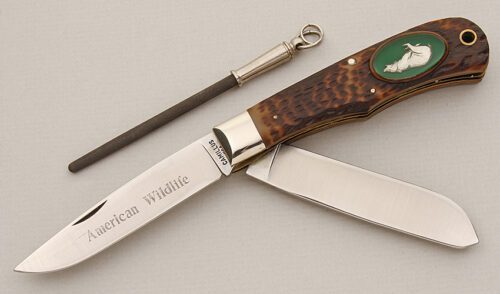 Camillus Cutlery Wildlife Series Trapper Bear with Brown Jigged Delrin Scales handle material - Obverse Side - Item #KLC15620