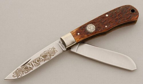 Camillus Cutlery 1988 NKCA Trapper with Brown Jigged Bone Scales handle material - Obverse Side - Item #KLC15690