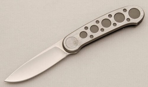 Pacific Cutlery Barry Wood Butterfly Folder with Machined Stainless Frame handle material - Obverse Side - Item #KLC15761