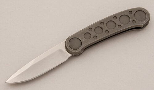 Pacific Cutlery Barry Wood Butterfly Folder with Machined Stainless Frame handle material - Obverse Side - Item #KLC15839