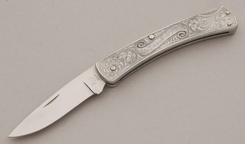 Buck Knives Model 513 Classic III with Engraved Aluminum Frame handle material - Obverse Side - Item #KLC15898