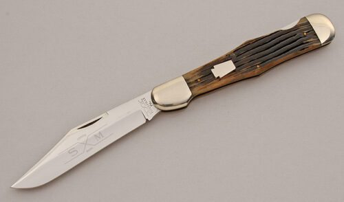 Schatt & Morgan Lockback Folding Hunter with Brown Jigged Delrin Scales handle material - Obverse Side - Item #KLC15952